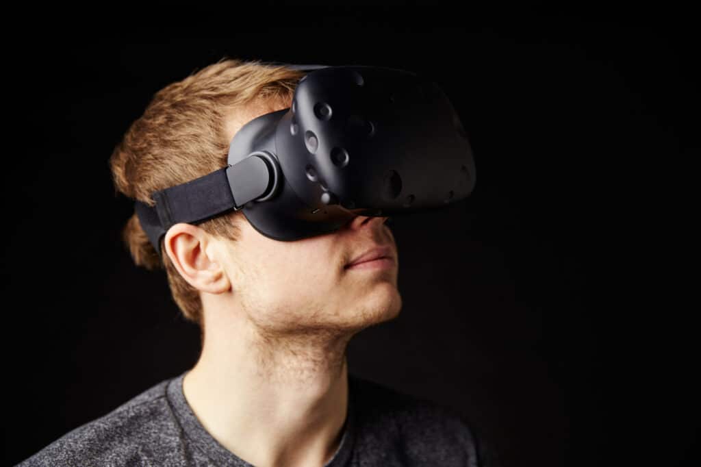 5 VR Training Myths 1 VR Training Myth #1: The technology isn’t ready yet. Man wearing VR headset.