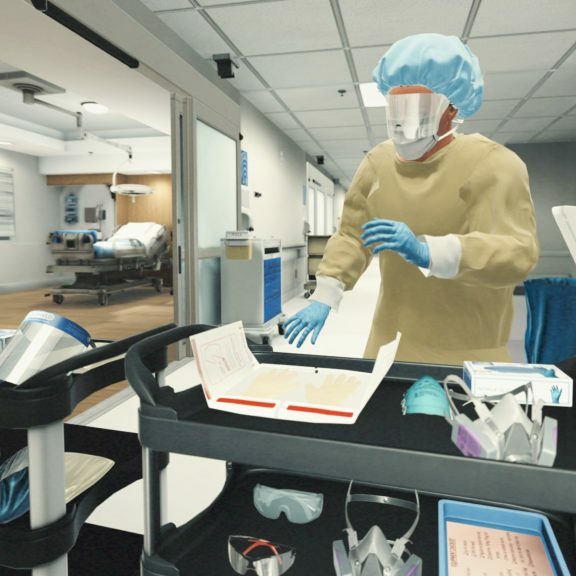Healthcare worker donning PPE